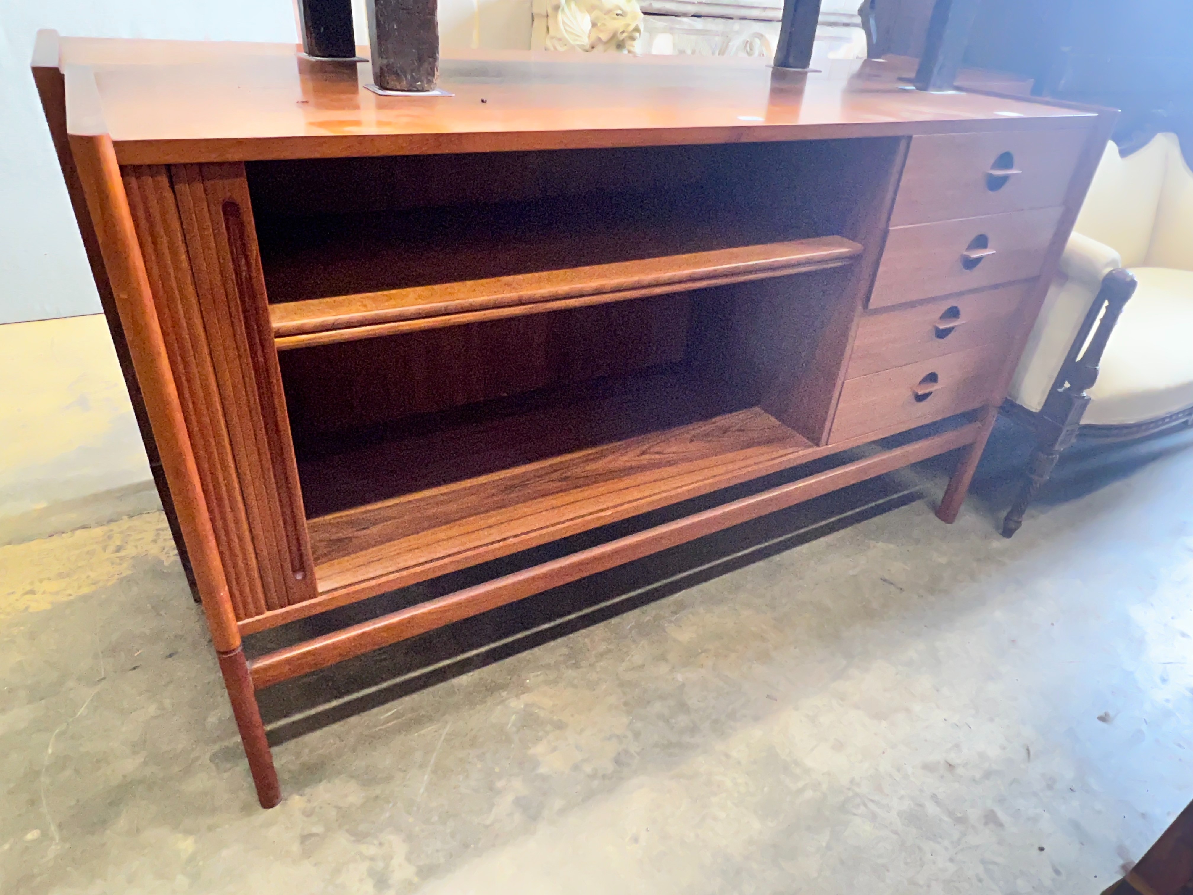 A 1950's Danish teak tambour four drawer sideboard, width 150cm depth 46cm height 86cm